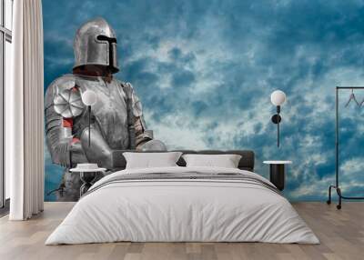 Knight in helmet and metal armor. Wall mural