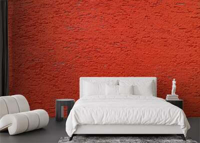 Red plaster wall of a building. Rough surface texture. Wall mural