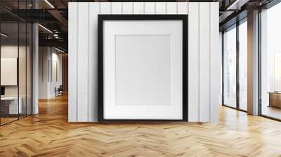 Black picture frame on wood table Wall mural