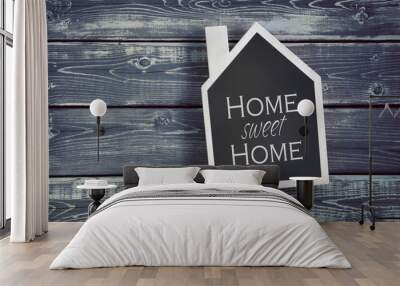 House shaped chalkboard on wooden background Wall mural