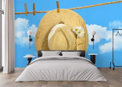 Straw hat on clothesline Wall mural