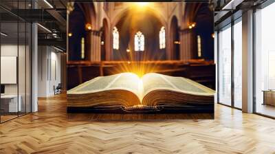 Open Holy bible book with glowing lights in church Wall mural