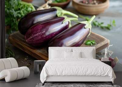 Fresh Eggplants on Rustic Wooden Board Wall mural