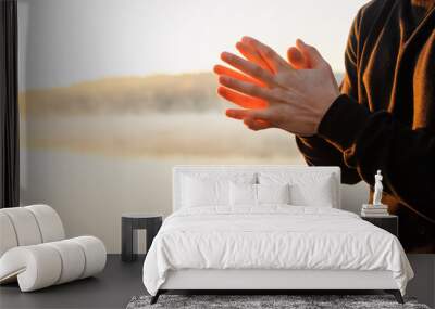 Man praying in the morning. Spiritual health concept. Wall mural