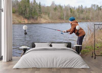 woman with fishing rod on the river Wall mural