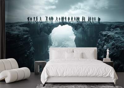 An image of a bridge made of people connecting two cliffs, symbolizing the bridging of divides in a democracy. Wall mural