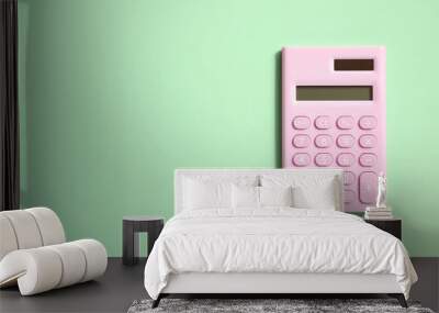 Pink digital calculator on green background Wall mural