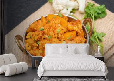 Aloo Gobi Indian curry dish with potatoes and cauliflower. sabzi- potatoes with cauliflower, Indian style vegetable curry. Traditional North Indian vegetarian curry dish Wall mural