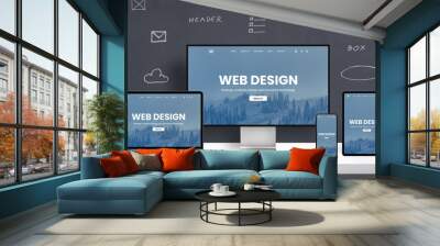 Responsive web design page promotion on different display devices. Office studio desk cioncept with web graphic elements on wall Wall mural