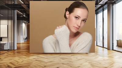 Winter, beauty or portrait of natural model in studio isolated on brown background for fashion or wellness. Face, skincare or space with confident woman or happy person in wool jersey or sweater Wall mural