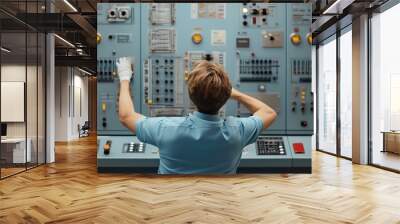 Man operating a complex control panel. Wall mural