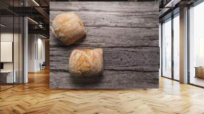 bread roll on a grey wooden table Wall mural