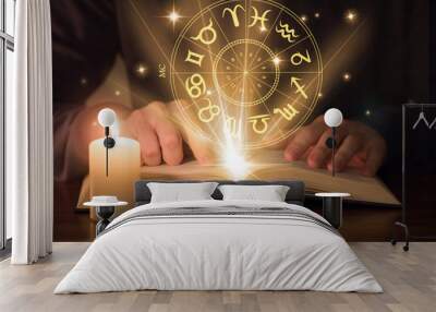 man reading astrology book Wall mural