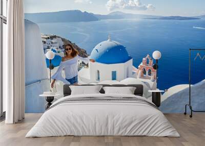 Beautiful young woman against  Santorini Wall mural