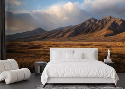 A stunning photo of a rarely seen mountain vista, taken during golden hour for soft, warm lighting Wall mural