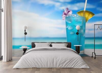 Blue hawaii cocktail on white wooden table with blue sea and sky background. Wall mural