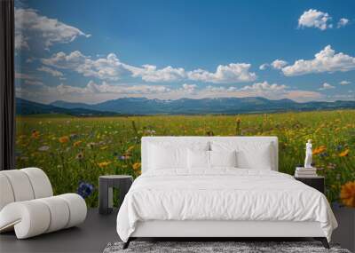 Idyllic meadow filled with wildflowers, with mountains in the distance under a bright blue sky --ar 16:9 Job ID: ed082cbf-77d3-4078-a4a3-a2a82b6a11bf Wall mural