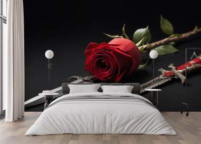 knife and red rose on black background Wall mural