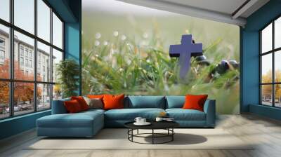 Black rosary on the grass with dew Wall mural