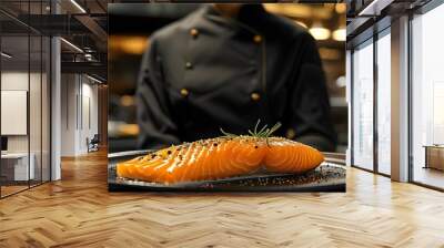 Culinary artistry: Chef showcasing close-up of salmon fillet in elegant restaurant kitchen Wall mural