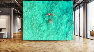 Aerial view of two girls swimming in the ocean in Gili Meno, Lombok, Indonesia Wall mural