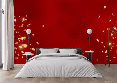 Red Luxury Background with golden confetti and stars. Red foil texture background. Christmas and Happy New Year banner with confetti. Metallic red background foil paper for luxury background. Wall mural