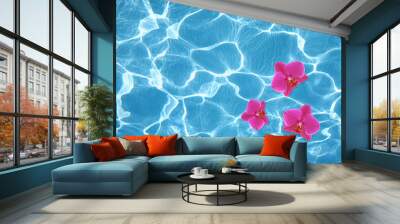 Three pink orchids floating on water in pool Wall mural