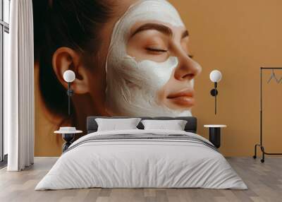 A beautiful young woman gently applying facial cream,with healthy skin and facial care, Cosmetic cream,dermatology Wall mural