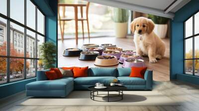 A cute and adorable Golden Retriever puppy sits expectantly, surrounded by an array of food bowls containing a variety of dry and wet food, chew snacks, and treats. Wall mural