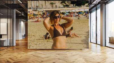 woman walking on the sand of the sea Wall mural