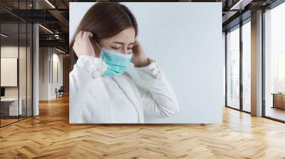 The business woman wearing protection face mask against coronavirus, PM 2.5 and cold. Coronavirus and Air pollution pm 2.5 concept. Wall mural