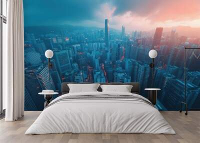 Stunning aerial view of a vibrant city skyline at sunset, showcasing skyscrapers and urban life under dramatic clouds. Wall mural