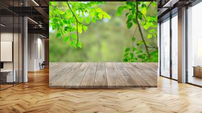 Wood floor with blurred trees of nature park background and summer season, product display montage Wall mural