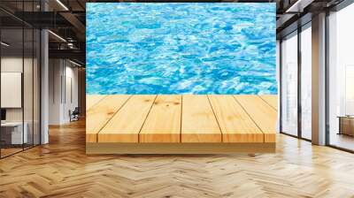 Wood table top on Surface water in pool background - can be used for products display Wall mural