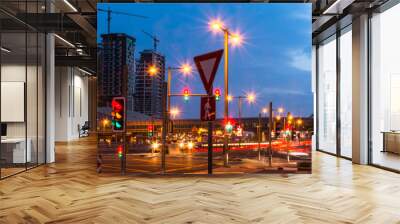 Colorful Traffic Signal lights in Dubai City beautiful night view of Dubai Metro station and buildings blue sky with street lights Wall mural