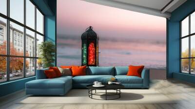 Traditional lantern lamp on the beach, Ramadan Kareem and Eid Mubarak background with copy space for text Wall mural