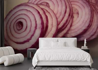 Close-up of sliced red onions on white cutting board Wall mural