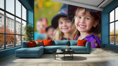 Portrait of cute smiling kids dressed in costumes for Halloween party. Trick or treat, adorable children wearing halloween costumes having fun at halloween night. Wall mural