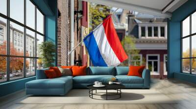 04 May every year, Remembrance of the Dead (Nationale Dodenherdenking) National flag of the Netherlands with half-mast, Memorial to victims of the world war two, Dutch flag hanging outside building. Wall mural