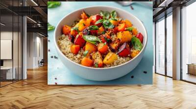 vibrant bowl of quinoa topped with roasted vegetables, including sweet potatoes and bell peppers, garnished with fresh basil. This healthy dish is perfect for nutritious meal Wall mural