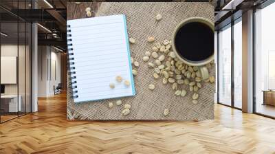 Coffee with notebook and pen on Sackcloth brown. Wall mural