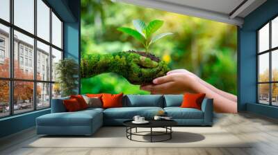 environment earth day in the hands of trees growing seedlings. bokeh green background female hand ho Wall mural