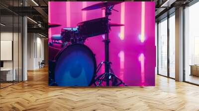 A drum set is on stage in a brightly lit room Wall mural