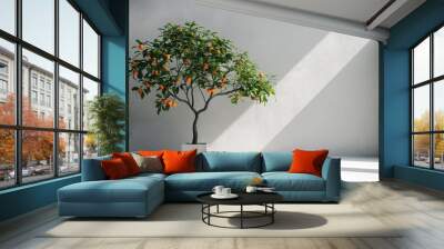 Potted citrus tree with ripe oranges in a bright room with sunbeams, symbolizing growth and vitality, Concept of nature indoors, home gardening, and freshness Wall mural