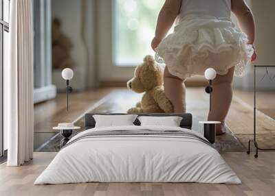 a little boy walking down a dirt road with a teddy bear, tiny toddler taking wobbly steps with a teddy bear Wall mural