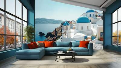 a view of a blue domed building on a cliff, A pristine Greek island village with whitewashed houses and blue-domed churches Wall mural