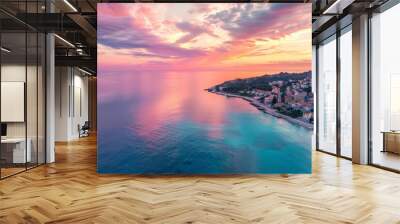 beautiful sunset over the ocean with beach and buildings, Drone photograph with all the color radiance of splendid sunrise over calm sea Wall mural