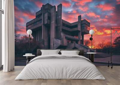 building with stairs and sunset in the background, An imposing neo-brutalist structure against pastel-hued sunset Wall mural