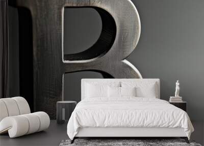 rough metallic letter B stylized with bold and modern font, representing strength Wall mural