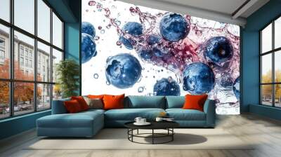 A close-up shot of blueberries exploding, with juice and berries flying, creating a dynamic scene against a white background. Wall mural